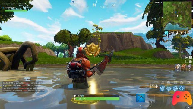 Trouvez la place entre les véhicules, la sculpture rocheuse et les haies dans Fortnite