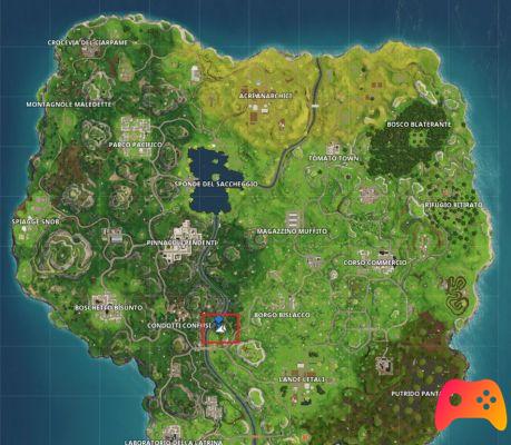 Trouvez l'endroit entre le pont métallique, les affiches et le bus détruit à Fortnite